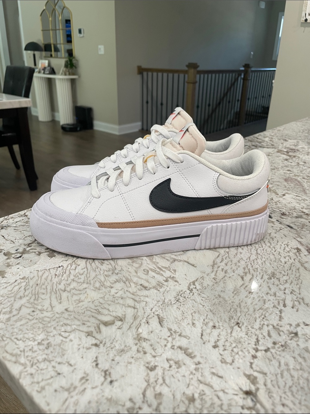 Nike Women's White Sneakers with Black Swoosh and Tan Accent